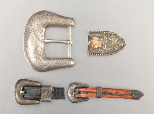 3 Roy Rogers Silver Belt Buckles RR: Includes Large Buckle (2-1/2" W) marked "Fred Holm Los Angeles"; The Edward Bohlin marked Belt Tip HAS BEEN REMOVED FROM LOT. Any bids placed prior will gladly be voided. Estimate has been lowered acc