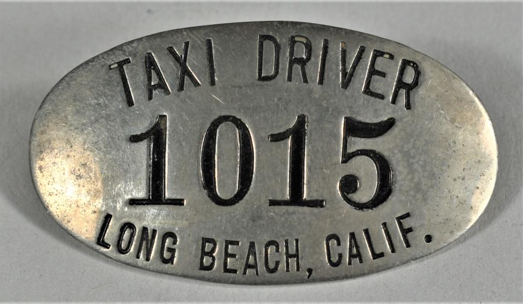 Antique Taxi Driver Badge for Long Beach, Calif: Taxi Driver Badge for Long Beach, Calif #1015. 2 X 1 1/8 inches.