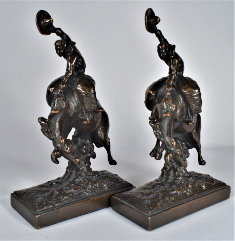 Armor Bronze Western Cowboy Let-er Buck Bookends: Armor Bronze Western Cowboy Let-er Buck Bookends. Ca. 1920's bronze. Signed by Artist Paul Herzel. 6 3/4 X 11 X 3 inches.