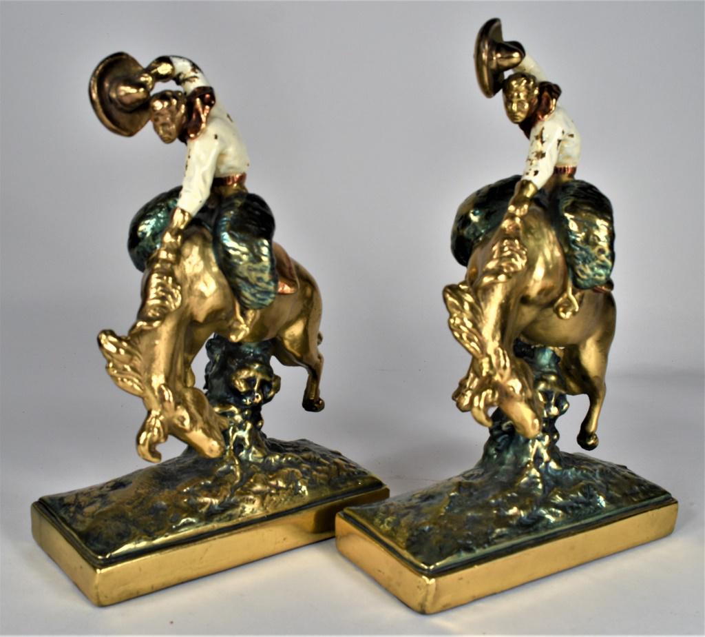 Armor Bronze Western Cowboy Let-'er-Buck Bookends: Armor Bronze Western Cowboy Let-'er-Buck Bookends. Ca. 1920's polychrome painted. Excellent condition. 6 3/4 X 10 X 3 1/4 inches each.