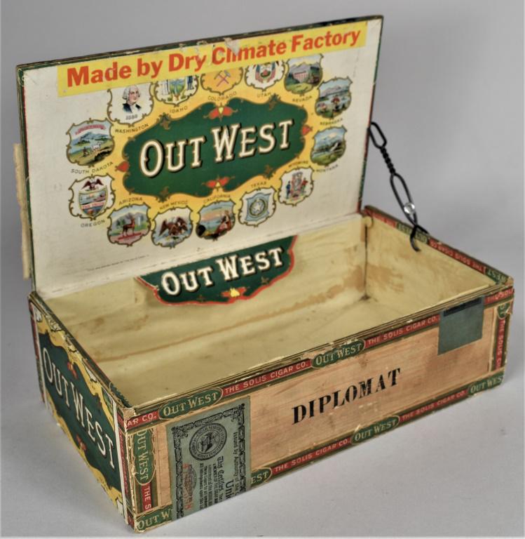 Out West Wood Cigar Box: Out West Wood Cigar Box. Solis Cigar Co. Beautiful original paper label depicting 14 western state shields on inside cover and left side. Some staining and edgewear. 9 X 2 1/2 X 5 inches.