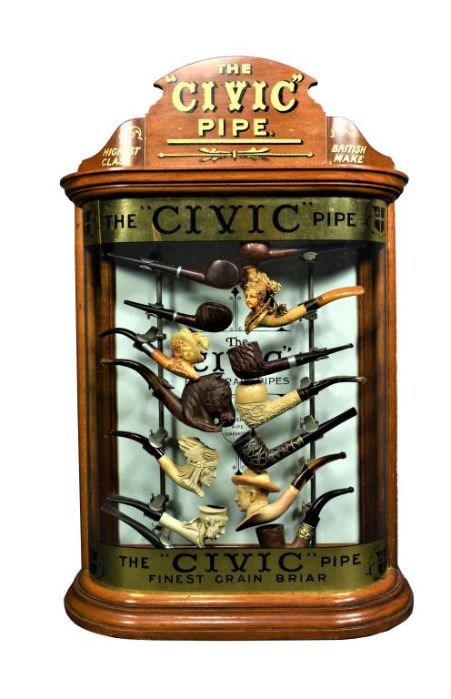 The "Civic" Pipe Curved Glass Store Display Case with Pipes: The "Civic" Pipe Curved Glass and Oak Store Display Case. This is the mother of pipe displays as it includes a beautiful collection of antique pipe. Meerschaum, wood, figural and sterling overlay. Ori