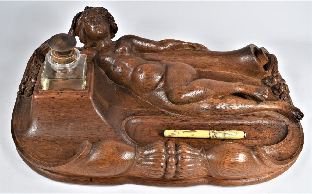 Hand Carved Reclining Nude Inkwell and Pen Holder: Late 1800's, Hand Carved Reclining Nude Inkwell and Pen Holder. Elaborate writing station for the desk. Comes with early celluloid pen. 17 1/2 X 6 X 11 inches.
