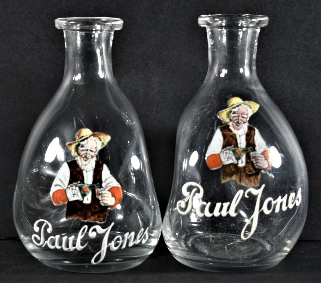 Enamel Label Pinch Bottles for Paul Jones Whiskey: Enamel Label Pinch Bottles for Paul Jones Whiskey. One bottle has minor scratch chips at top rim. 6 1/2 inches tall.