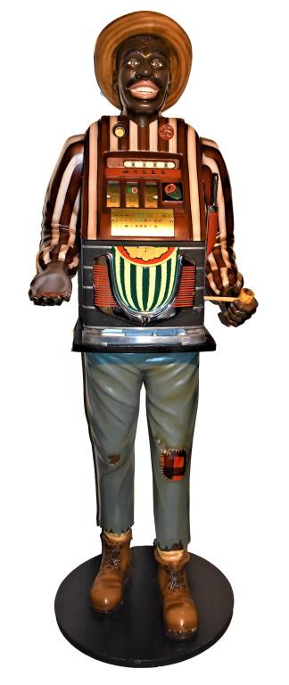 Watermelon Jake Mills 25 Cent Slot Machine: Watermelon Jake One Armed Bandit Mills 25 Cent Slot Machine. Hand carved by Jim Smock, Santa Barbara, Calif. Known as one of the finest carvers in the world. Excellent working condition. 79 inches tal