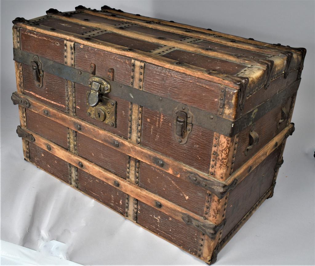 Doll Size Steamer Trunk: Doll Size Steamer Trunk. Wood and iron, great patina with original insert. Stamped Helma. on the side. Brackets for side handles but no leather intact. 20 1/4 X 13 1/4 X 11 1/4 inches.