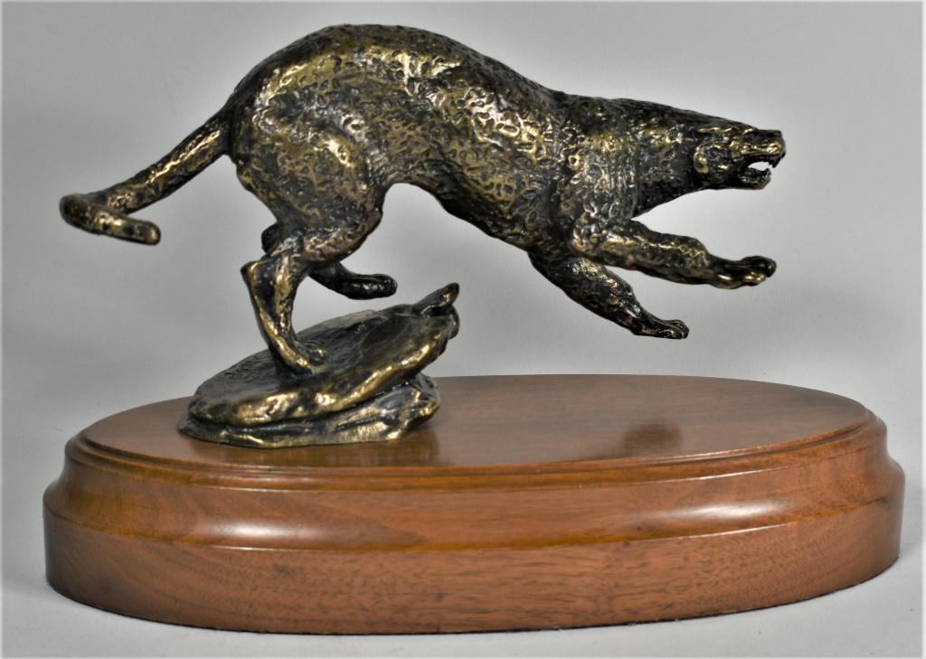 1982 Wally Shoop Bronze Cougar Panther Sculpture: 1982 Wally Shoop (1941-present) Bronze Cougar Panther Sculpture. Mounted on wood. 10 X 7 X 4 inches overall.