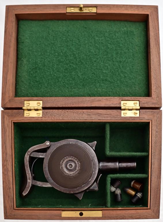 Cased Chicago Firearms .32RF Palm Pistol: "Protector" S/N 5106. In good condition, with wood presentation case.