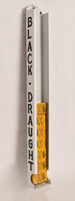 Black Draught Advertising Country Store Rack: Porcelain rack with 14 packs.