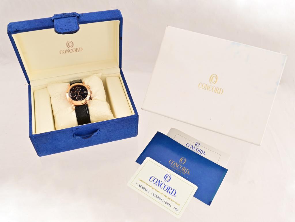Concord 18K Gold Men's Watch: DeBeer 18k gold crocodile leather band. Original box and paperwork