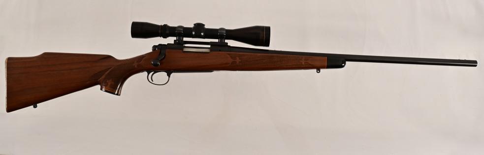 Remington Model 700-BDL .222 Rifle Leupold Scope: * 24" barrel. Walnut; Checkered stock. Redfield Mount; Leupold 3X9 Variable Scope; Sling. Blued Steel. New condition. SN 258382