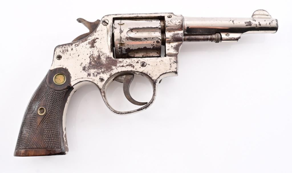 T.A.C. Double Action Revolver- S&W Spanish Copy: S/N 155923 . Trocaola, Aranzabal Y Cia (T.A.C.) nickel plated S&W double-action copy revolver, 4.25" barrel, checkered wood grips.