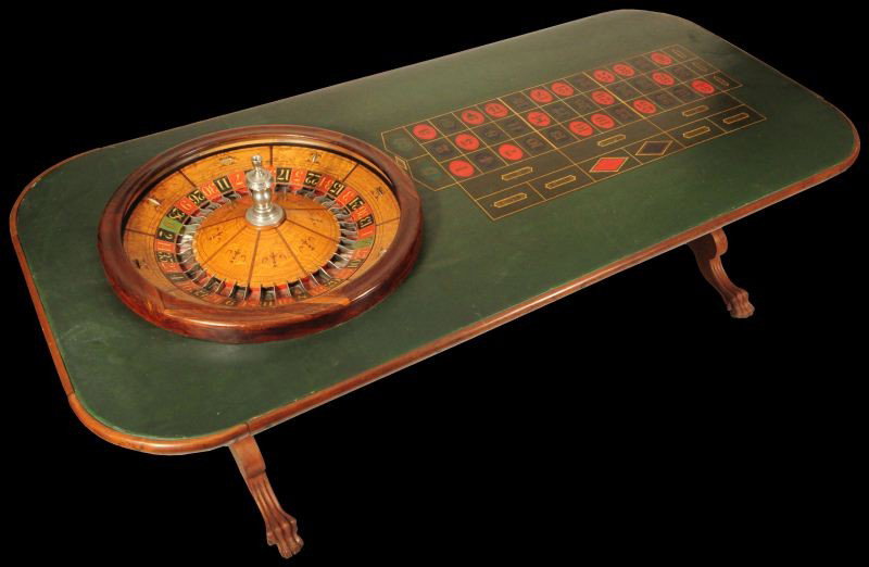 Mason Roulette Wheel & Claw Foot Table: Mason Roulette Wheel is in good original condition. Spins well. Claw foot table has original betting canvas in good condition. Mason Marked Wheel measures 31-1/2" D. Table is approx. 8 ft x 3-3/4" ft.