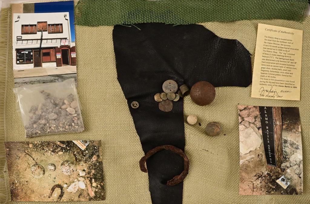 Alamo Battlefield Relics: Includes Cannon Ball, Grape Shot, Mexican Rifle Shot, Clothing Buttons, Thimble, Iron object, Soil from the dig and Photos of the excavation.