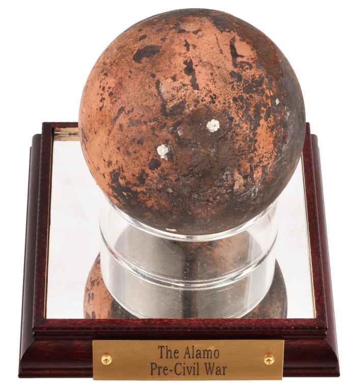 The Alamo Battlefield Cannonball: Cannonball 3.5" Modern Case 5" x 5" x 5.25" marked with brass tag "The Alamo". Post Texas Revolution/Pre-Civil War Alamo Cannonball. Reportedly found at the Alamo and stored by the 1st Texas Artillery