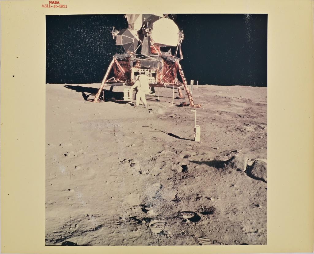 Apollo 11 Buzz Aldrin NASA Red Number Photo: NASA Red Number AS11-40-5931 Kodak photo 8" x 10". Astronaut Edwin E. Aldrin Jr., lunar module pilot, prepares to deploy the Early Apollo Scientific Experiments Package (EASEP) on the surface of the M