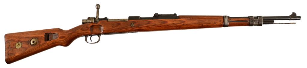 Nazi Steyr Puch K98 Mauser Rifle: S/N 7098, dated 1940. Rifle has multiple Nazi proof marks across receiver and barrel. Stock is original numbered to gun, with Nazi Eagle cartouche. Numbers matching barrel, receiver, butt-plate and ma