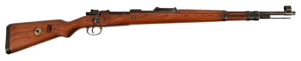 WWII Nazi German Mauser M98 Rifle 8mm: S/N 9828J. Nazi eagle proof marks throughout rifle. Barrel measures 24". Very good bore rifling and action.