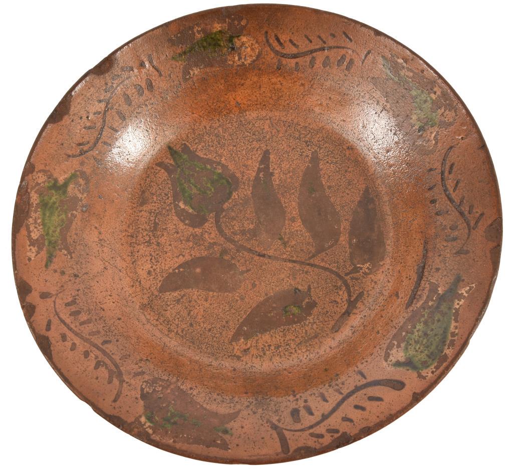 J.L. Blaney, Cookstown Pennsylvania Redware Plate: Rare multi-colored pie plate Cookstown, Pennsylvania, mid 19th century. Green and yellow slipware tulips. Impressed "J.L. Blaney, Cookstown, Pa". Imperfections include edge chips, some filled in, surf