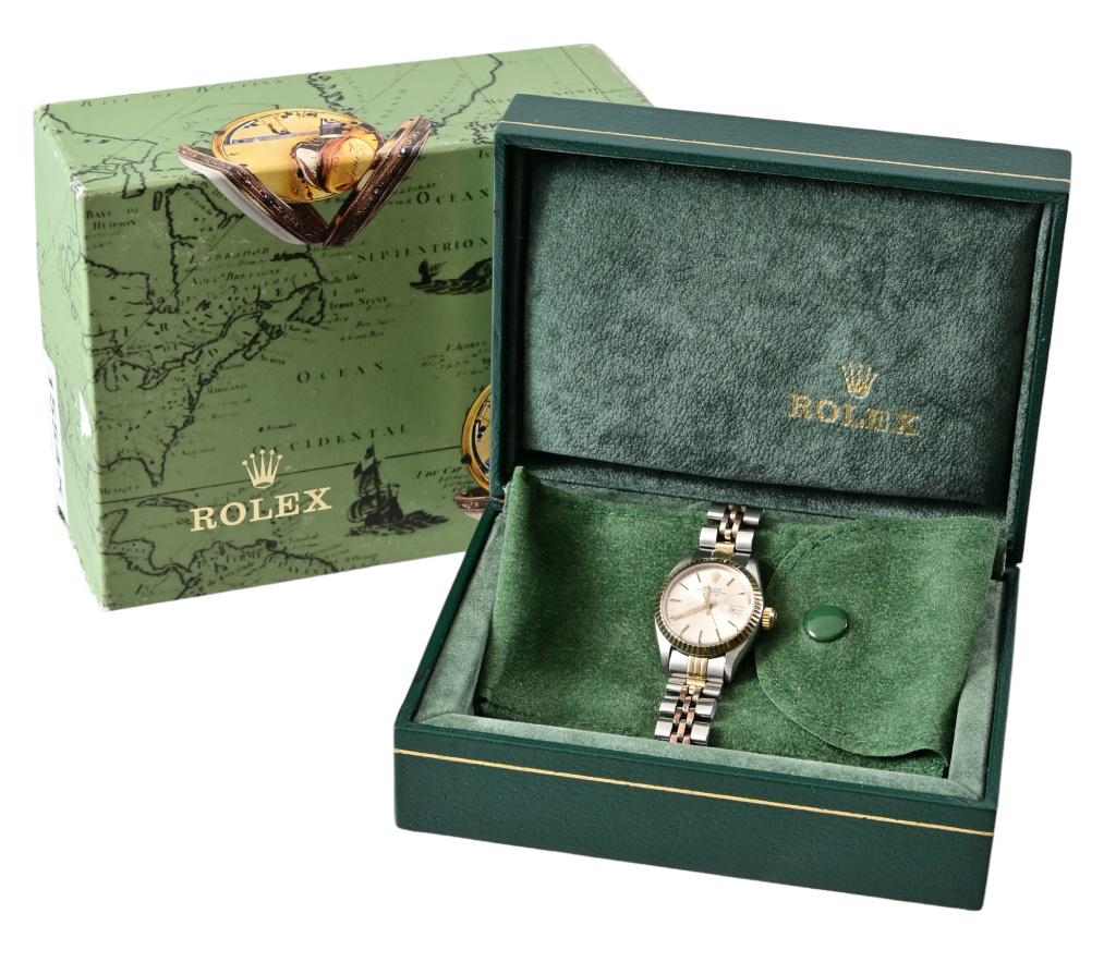 Rolex Ladies' Oyster Perpetual Date Watch: Stainless/ 14k gold watch and band. Original box and paperwork