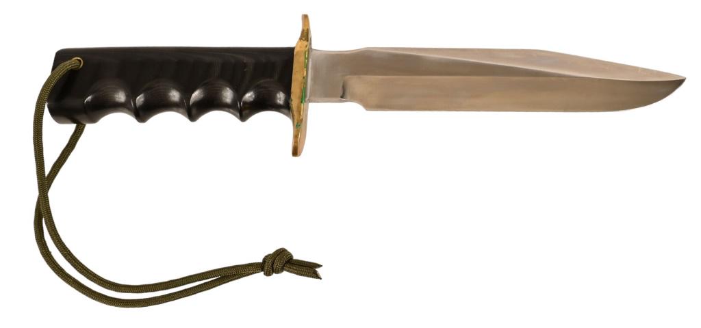Randall Made Fighter Knife & Scabbard: Model #16 SP#1. Micarta handle with finger grooves, paracord lanyard, 6.75" blade length, 11.5" overall length. Comes with original Randall leather scabbard and sharpening stone.