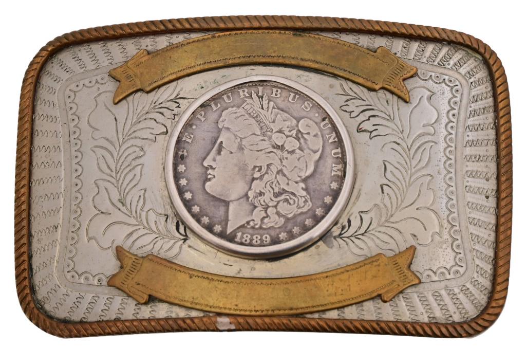 Belt Buckle With 1889 Silver Dollar: Nickel Silver, Brass rope edge and ribbons. 4" x 2 5/8".