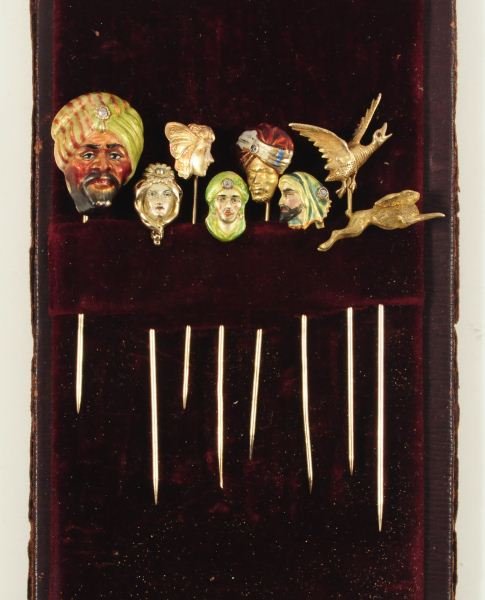 Collection of 8 Gold Assorted Figural Stick Pins: Includes 6 Head, 1 Rabbit and 1 Pheasant. Three head pins marked 14 Kt. and five have diamonds.
