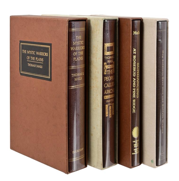 Four Thomas E. Mails Signed Indian Books: All signed limited editions by Thomas E. Mails. "The Mystic Warriors Of The Plains" No. 94 of 250. Copyright 1972. " Dog Soldiers, Bear Men and Buffalo Women". No. 87 of 250, Copyright 1973. "The Peop