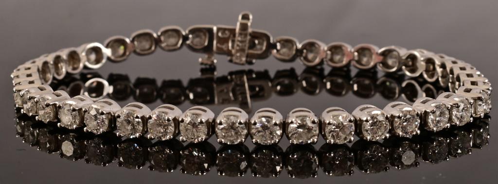 14K White Gold Diamond Tennis Bracelet: With Appraisal. "One 14kt. white gold diamond tennis bracelet. The bracelet measures about 7.5 inches long and contains forty (40) round brilliant cut diamonds with a total approximate weight of 6.50 