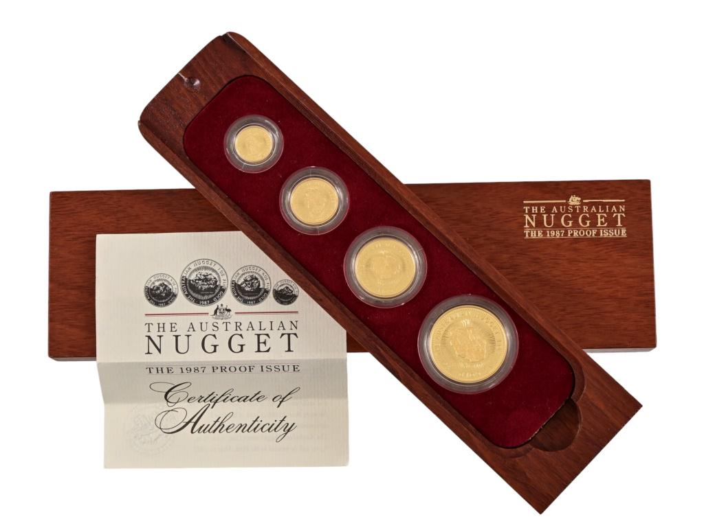 1987 Australian Gold Nugget Proof Set: Contains a one ounce, one/half ounce, one/quarter ounce, and a one/tenth ounce gold coins in proof. Together with a Certificate of Authenticity in original wood case and original packaging.