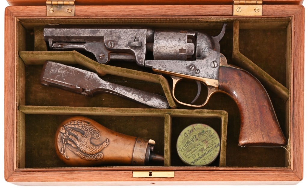 Cased Colt 1849 Pocket Revolver .31 Caliber: S/N 161933, manufactured in 1860. All numbers matching including cylinder. Walnut grips, 4" octagon barrel. Cylinder does not time and hammer does not cock into full position. Civil war era cased Colt
