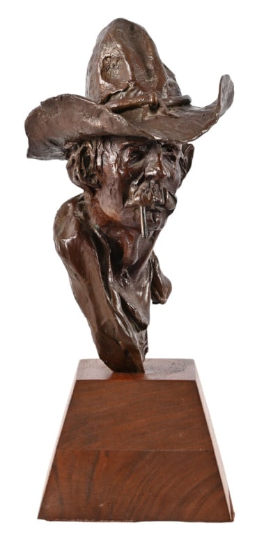Buck McCain Bronze Sculpture: Numbered 18/20, on custom oak base. Measures 4.5" x 6.5" x 11"