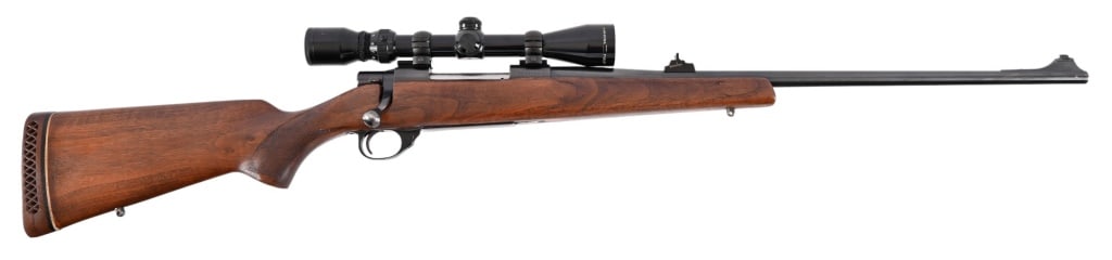 Smith & Wesson Model 1500 Bolt Action 7mm Magnum: S/N PN04102. Manufactured in Japan by Howa. The company made the S&W Model 1500, the Mossberg Model 1500 and still makes the Vanguard model for Weatherby. Nicely figured oak stock, 24" barrel, Simmons