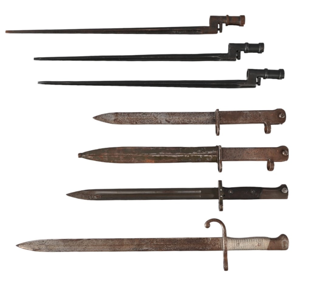 Collection of 7 Military Bayonets: Includes; Modelo 1891 Argentine Mauser bayonet by Kirschbaum/Germany. Unmarked bayonet with 11.75" blade. 2 - all metal bayonets 9" blades with double barrel loops, one has sheath. 3 Mosin Nagant spik