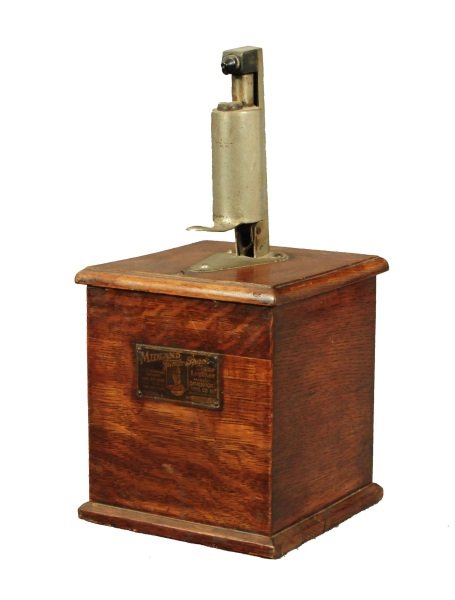 Midland Counter Top Jump Spark Cigar Lighter: "Midland Jump Spark Cigar Lighter made by Davenport mfg. co. inc. Davenport, iowa model L No. 126107". Measures 7" wide x 7" deep x 15" tall.