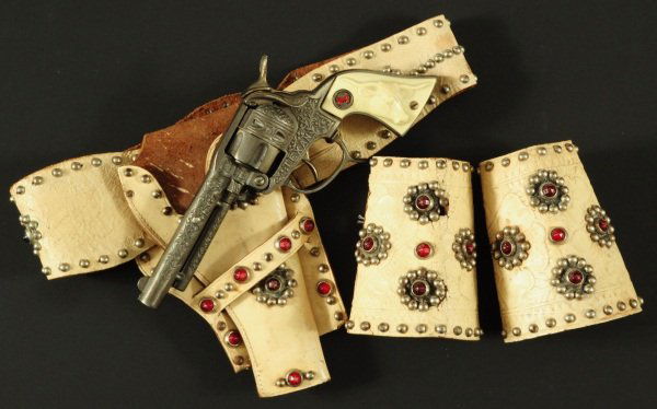 Colt Texan Toy Cap Gun With Holster Rig & Cuffs: Gun, Holster Rig and Pair of Cuffs.