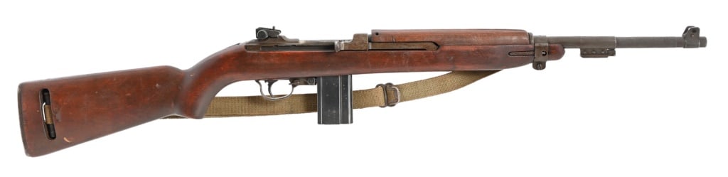 Inland M1 Carbine .30 Cal: SN 445360. Metal and wood good condition, light cartouche on stock. 18" barrel dated 5/43, bore is good. Has sling, 1 - 15rd mag. Modern.