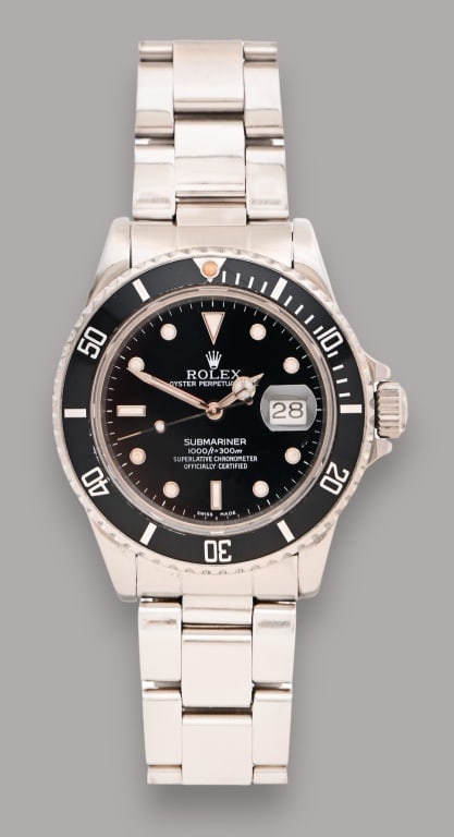 Rolex Submariner Oyster Perpetual Date Watch: Men's Rolex Oyster Perpetual Submariner Date in Oystersteel with a Cerachrom bezel insert in black ceramic and a black dial with large luminescent hour. Chronometer officially certified. With box and 