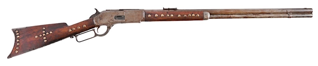 Winchester 1876 Lever Action .45-75 Indian Tacked: S/N 1412, early manufacture 1876. Winchester Model 1876 lever action rifle, .45-75 caliber. Blue finish, 28" octagon barrel, set trigger, Indian Tacked rifle, in fairly decent condition considering it