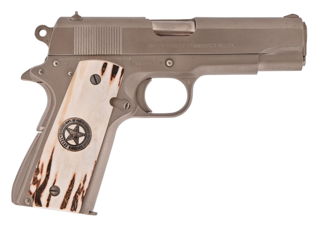 Texas Ranger Sgt Jim Huggins Colt Commander 1911: S/N 70SC65941. .45 ACP, manufactured 1977, 4.25" barrel.. Custom Sambar stag grips with Texas Ranger badge inlay. Very nice condition and bore. Comes with COA from Jim Huggins. Modern firearm.