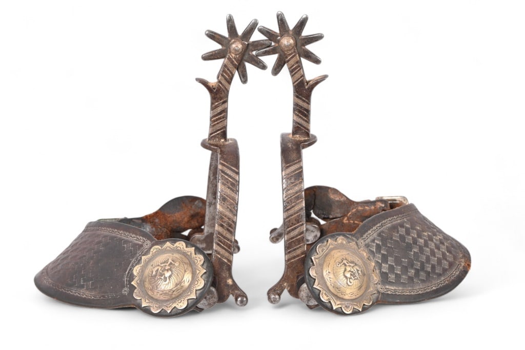 Rawlins Wyoming Prison Made Spurs: Scarce non-offset shank pattern from Rawlins Prison examples. Large strap conchos feature bronc rider scene. 8-point 1.75" rowels.