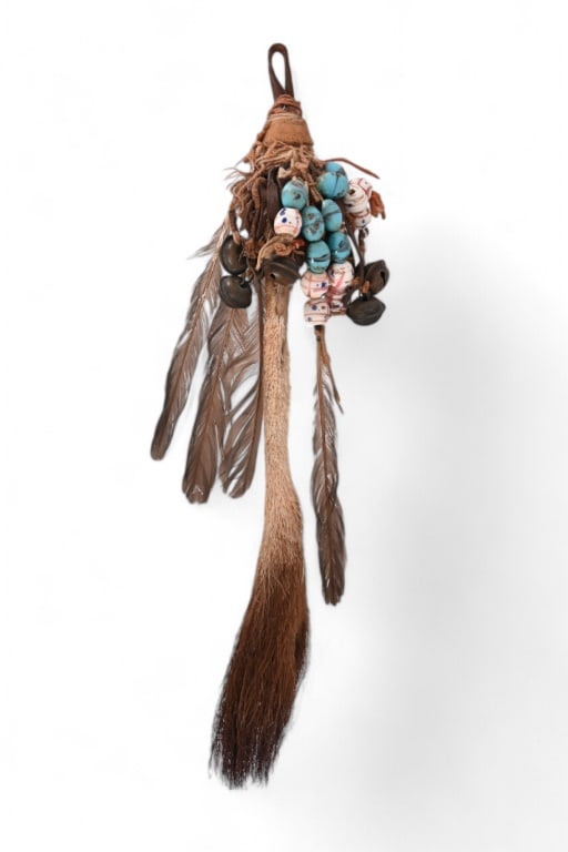 Crow Medicine Item Beaed Deer Tail With Bells: Black Deer Tail with small trade beads used to shake and make noise. 11" long.