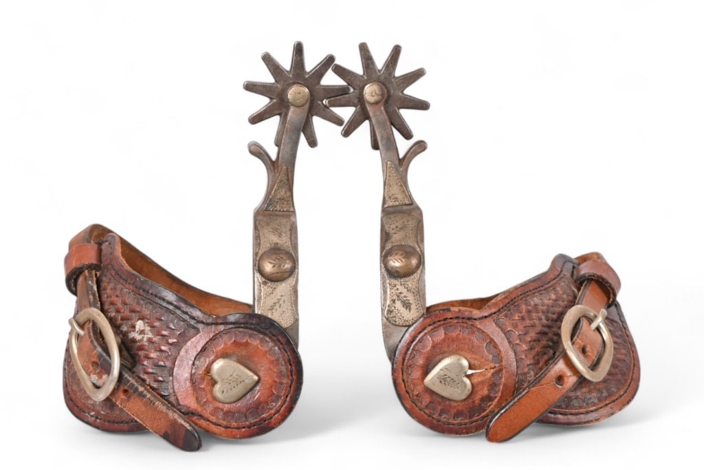 Crockett Marked Spurs With Tooled Straps: Heart buttons with 8-point rowels. Tooled leather straps.