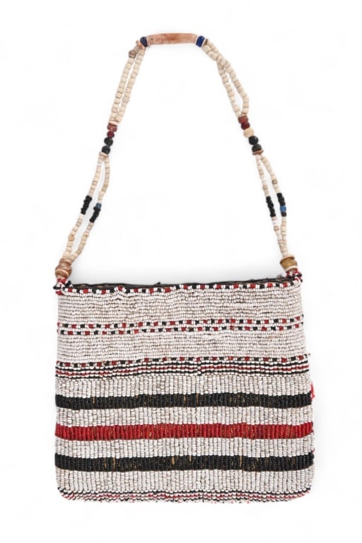 Indian Beaded Purse: Fully beaded in red, white and black beads. Strap is decorated with trade beads, antler sections and stone. Purse measures 6.25" x 7.5"