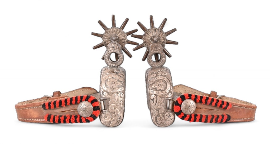 Fancy Mexican Spurs: Fully engraved heelband which features a lucky horseshoe motif. Figure 8 shank with rowel guard, cover 3" rowels.