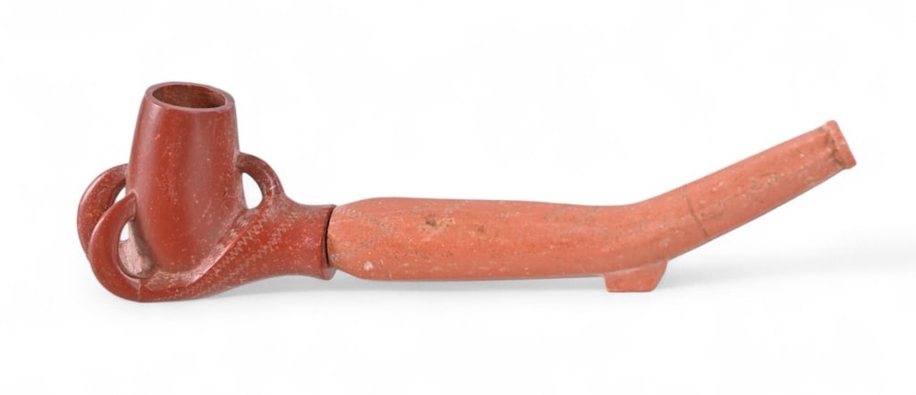 Indian Claw Head Ceremonial Pipe: Catlinite ceremonial clawhead pipe and stem. Missing one talon. Measures .75" x 1.75" x 6.75"