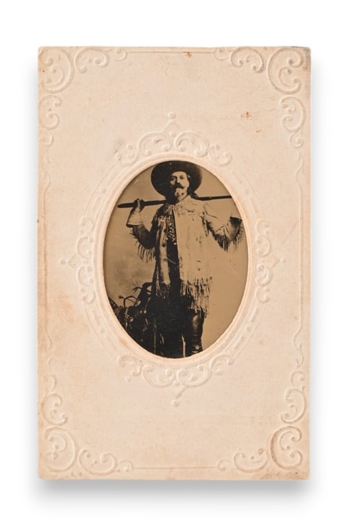 Rare Buffalo Bill Original Tin Type Photograph: William Frederick Cody, "Buffalo Bill" (1846-1917). Shown in his full fringed buckskin outfit, posed with lever action rifle over his shoulders. 2 3/8"