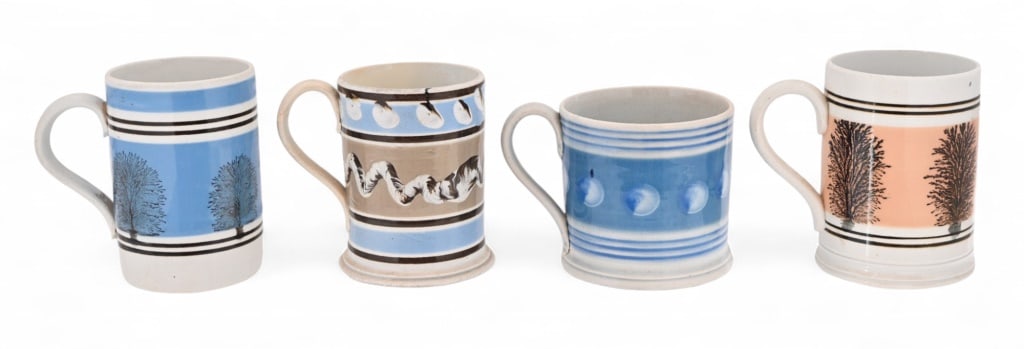 Four Antique English Mochaware Mugs: Circa 1800's. Measure 4" and 5" in height.