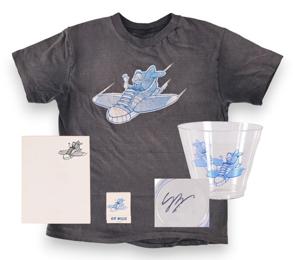 Willie Nelson's "Air Willie" T-Shirt & Memorabilia: Extra Rare memorabilia circa 1983, from aboard Willie Nelson's "Air Willie." T-shirt, notepad, matches and plastic cup, signed by AND from the collection of original Willie Nelson artist Steve Brooks!