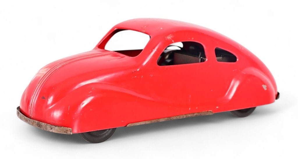 Vintage Nylint Red Pressed Steel Wind-Up Toy Car: Circa late 1940's. Working condition 5" x 5" x 14"